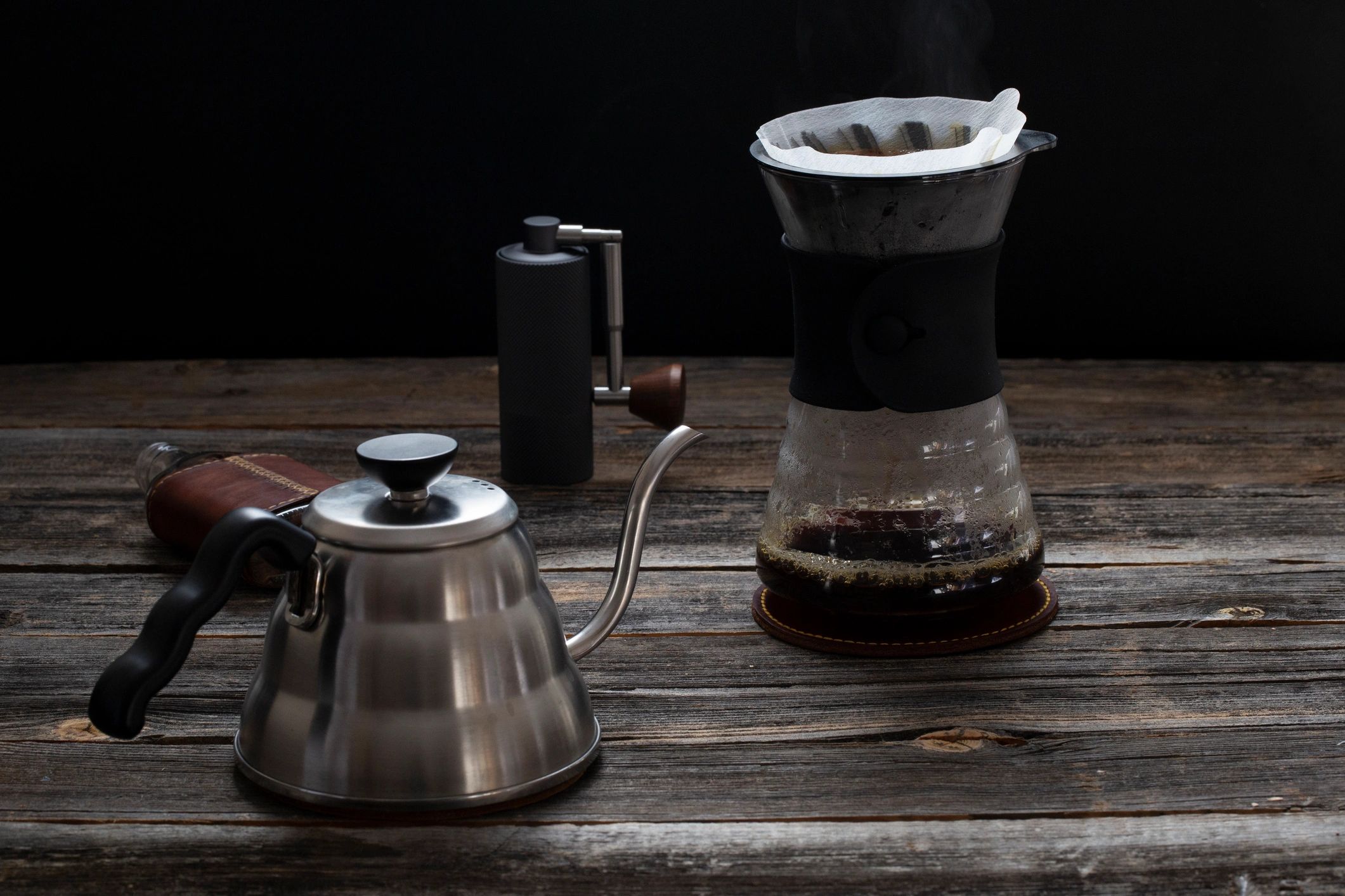 Pour-over coffee brewing equipment on a wooden surface