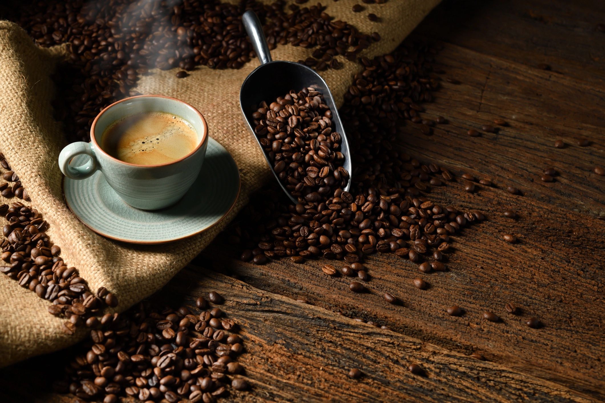 Coffee and beans on rustic wood