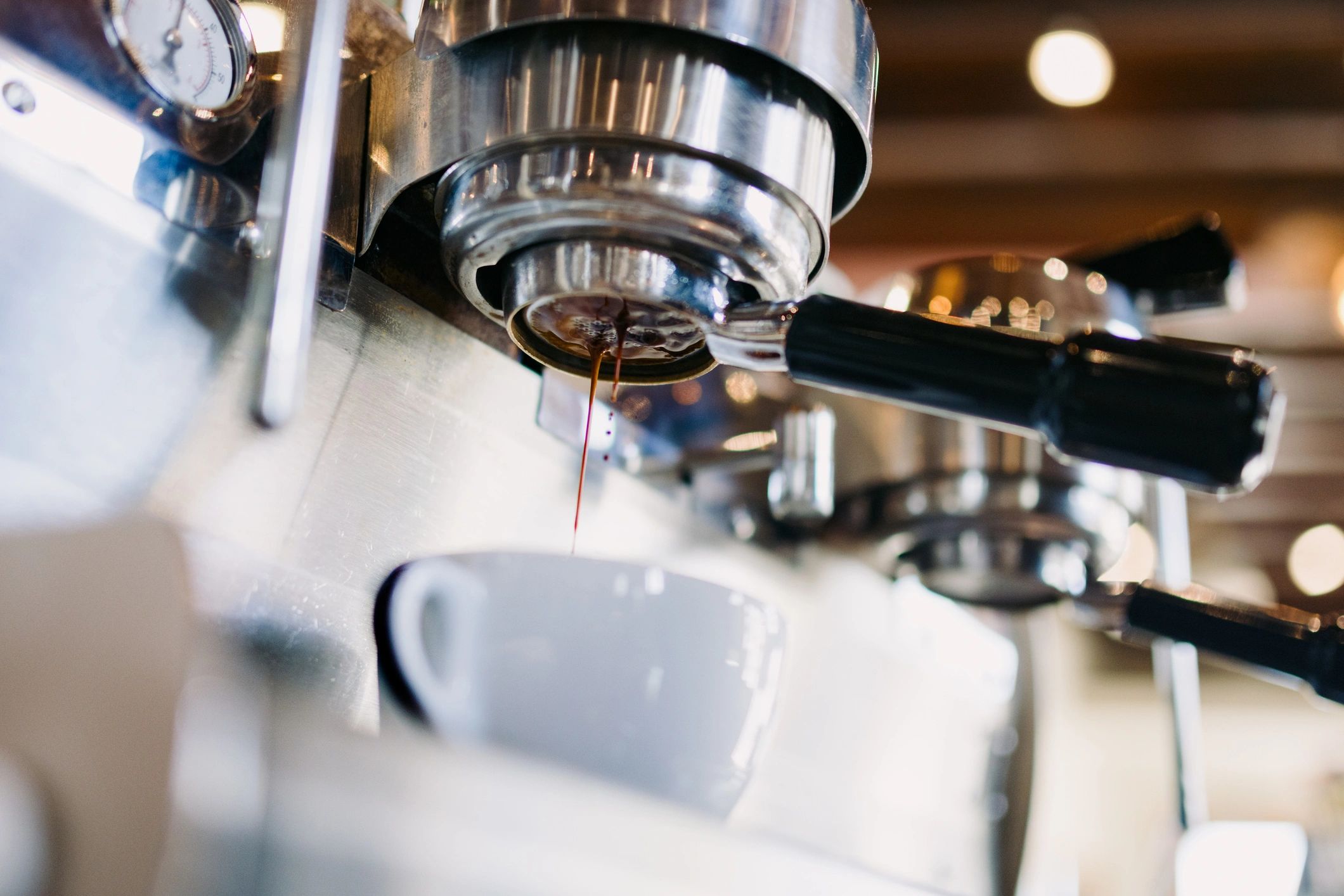 Espresso dripping from a portafilter