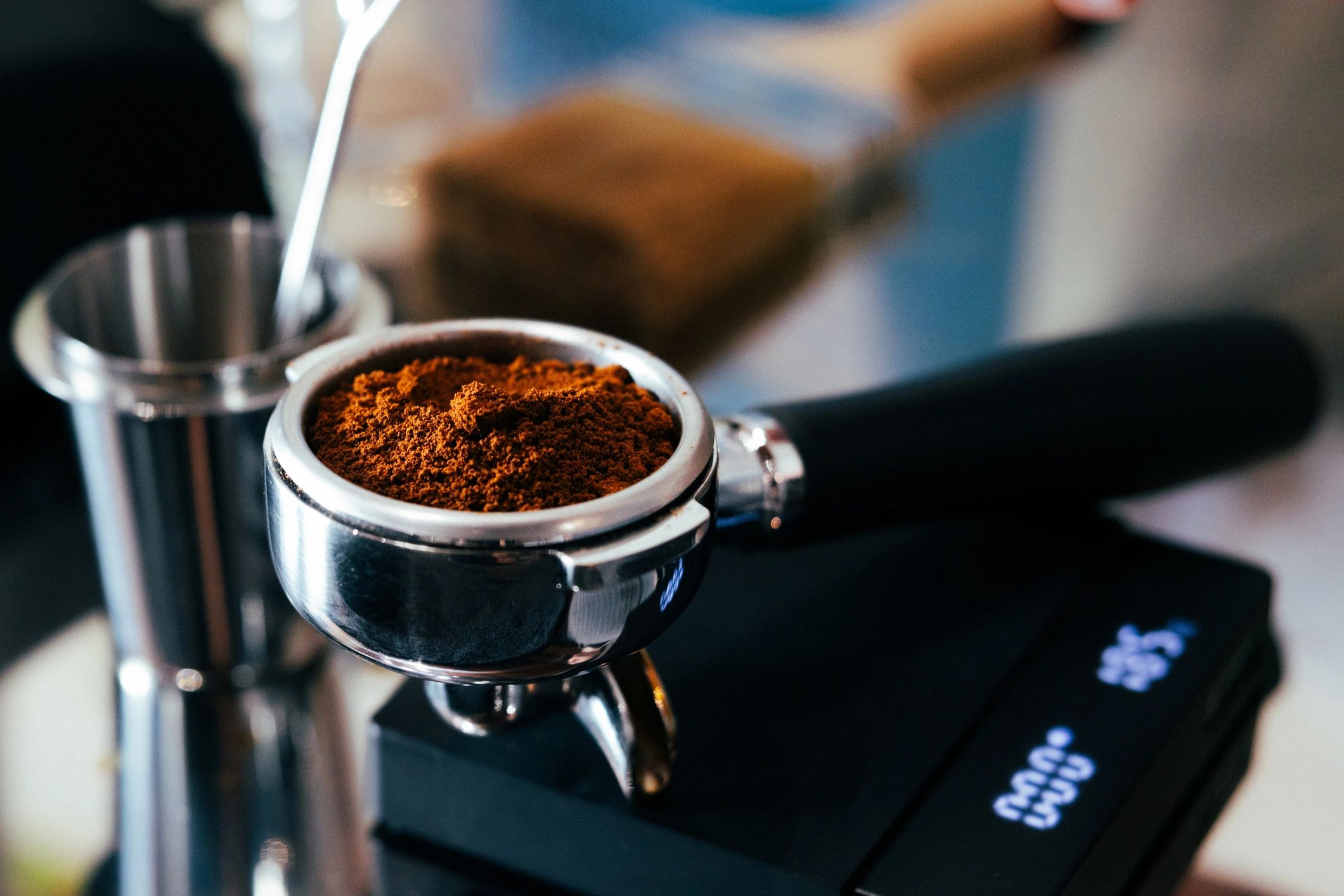 Espresso pouring from a machine into a cup